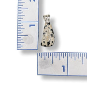 Pendant with a speckled stone design on a white background with measurement rulers.