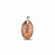 Brown oval pendant with gold accent on a white background