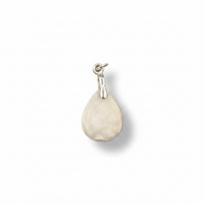 Teardrop-shaped pendant with a silver hook on a white background