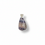 Teardrop-shaped stone pendant with a decorative metal cap on a white background