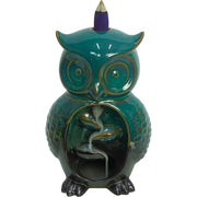 Teal owl-shaped incense burner with a purple cone on a white background