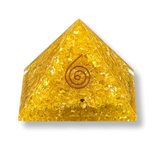 Orgonite pyramid with Citrine and Yellow Onyx on a white background