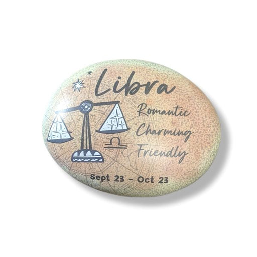 Round stone with Libra zodiac design and text on a white background