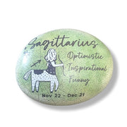Art stone with Sagittarius zodiac design on a white background