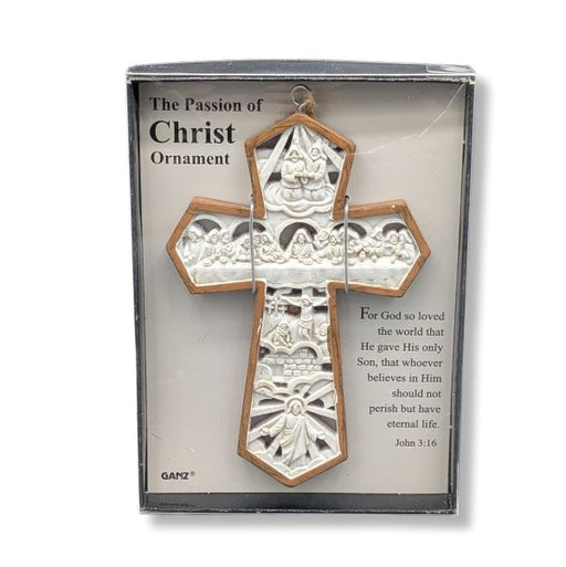 Decorative cross ornament in packaging with religious text