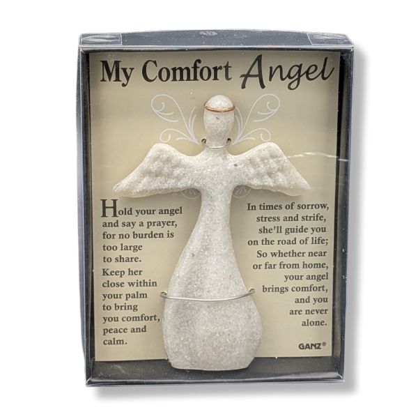 A packaged comfort angel figurine with a printed message card behind it. The product includes a small white angel statue and a beige insert card titled "My Comfort Angel" with comforting text, shown in a clear-front gift box.
