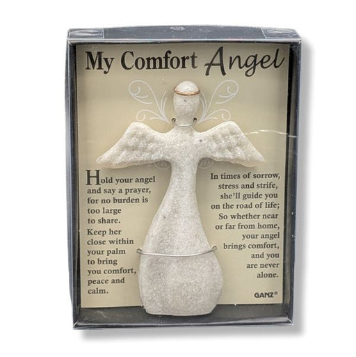 A packaged comfort angel figurine with a printed message card behind it. The product includes a small white angel statue and a beige insert card titled "My Comfort Angel" with comforting text, shown in a clear-front gift box.