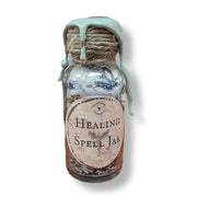 Healing spell jar with decorative label on a white background