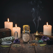 Spells jar with candles, crystals, and other mystical items on a dark background