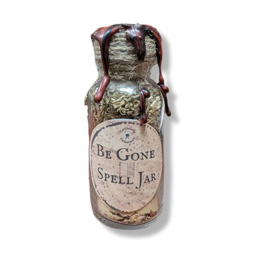 Spell jar labeled 'Be Gone Spell Jar' with herbs and a label on a white background