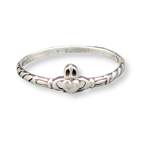 Silver claddagh ring on a white background