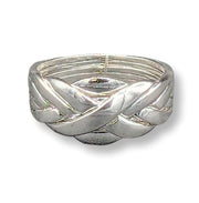 a sterling silver puzzle ring on a white background