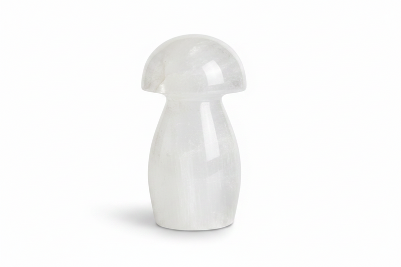 A small mushroom-shaped decorative object made of selenite, shown on a clean white background.
