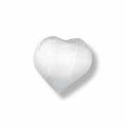 A heart-shaped selenite shown on a clean white background with a soft shadow.