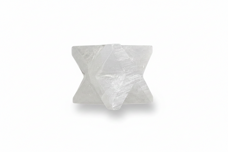 A Selenite Merkaba shown on a clean white background with a soft shadow.