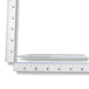 A selenite pencil wand with a ruler for measurement on a white background