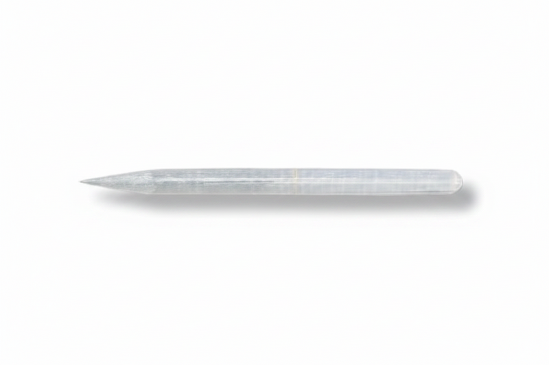 A selenite pencil wand shown horizontally on a plain white background with a soft drop shadow.