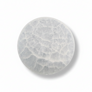 A selenite charging plate shown on a clean white background with a soft drop shadow.
