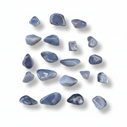 Collection of blue stones on a white background