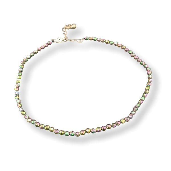 Anklet with multicolored beads on a white background