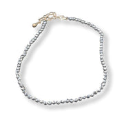 Silver hematite anklet on a white background