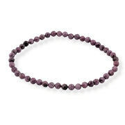 Red beaded bracelet on a white background