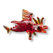 Glass figurine of a red and gold dragon on a white background