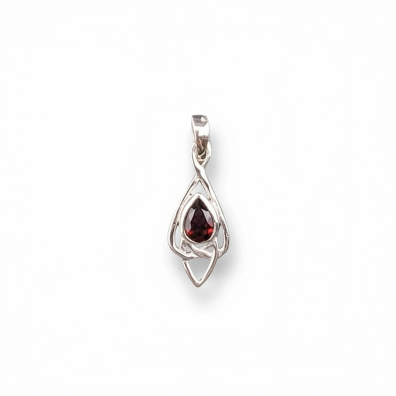 Silver pendant with a red gemstone on a white background