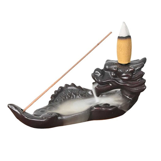 Dragon-shaped incense burner with a single incense stick on a white background