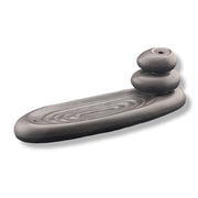 Black ceramic backflow incense burner on a white background