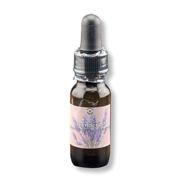 Bottle of lavender oil with a dropper on a white background