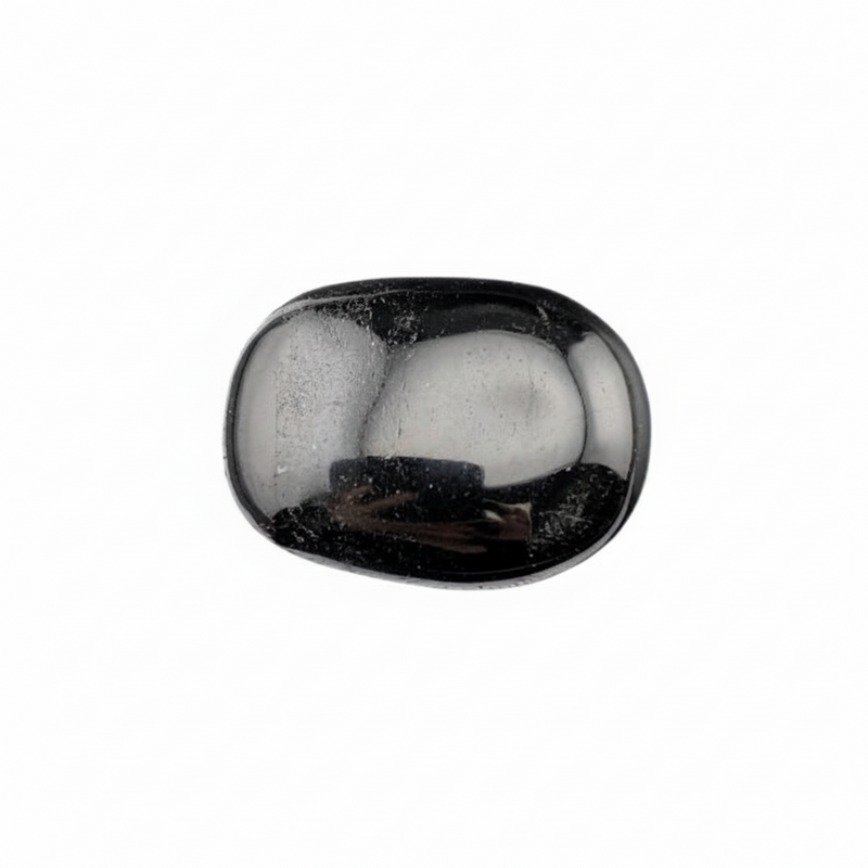 Black tourmaline palm stone with a reflective surface on a white background