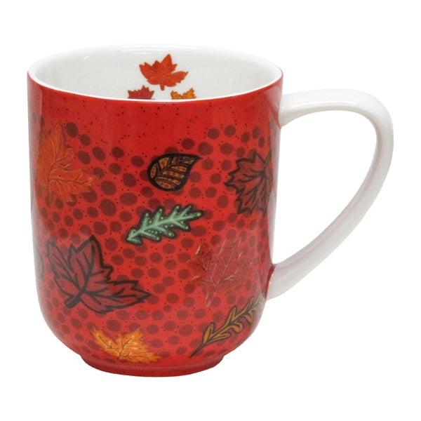 Red mug with leaf patterns on a white background