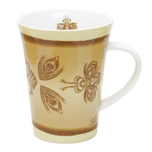 Mug with brown leaf and bee patterns on a white background