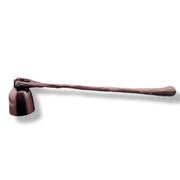 a metal candle snuffer on a white background