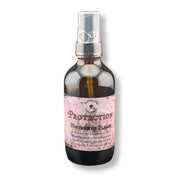 A dark amber glass spray bottle with a  label reading 'Protection Fortress of Flame'. on a white background