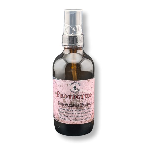 A dark amber glass spray bottle with a  label reading 'Protection Fortress of Flame'. on a white background