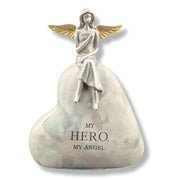 Statue of an angel sitting on a heart-shaped base with 'My Hero, My Angel' text on a white background