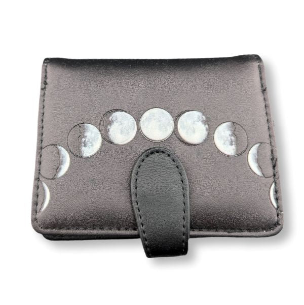 Small gray wallet with moon phase designs on a white background