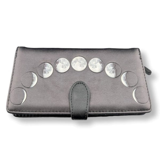 Black wallet with silver moon phase embellishments on a white background
