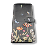 Black wallet with floral and dragonfly designs on a white background