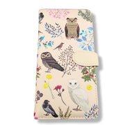 Large zipper wallet with owl and floral design on a beige background