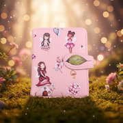 Pink wallet with fairy designs on a grassy background with bokeh lights