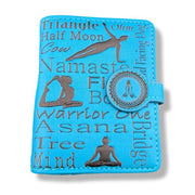 Blue yoga-themed notebook with yoga poses and words on a white background
