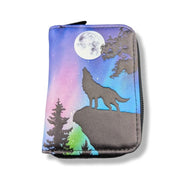 Zipper pouch with a wolf howling at the moon design on a white background