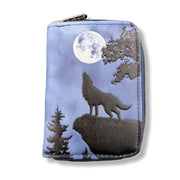 Zipper pouch with a wolf howling at the moon design on a blue background