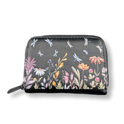 Small black zippered pouch with floral and dragonfly pattern on a white background