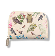 Small pouch with owl and bird design on a beige background