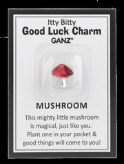 Red mushroom charm on a GANZ branded card with text.