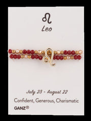 Leo bracelet with red and gold beads on a card, featuring the GANZ brand.